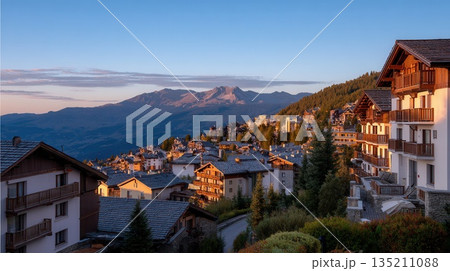 Scenic Mountain Village at Sunset with Beautiful Architecture 135211088