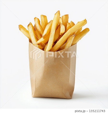 A brown paper bag filled with golden, crispy French fries is shown against a white background. 135211743