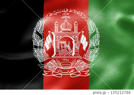 Afghanistan national flag with traditional red green black colors and central emblem. 135212788