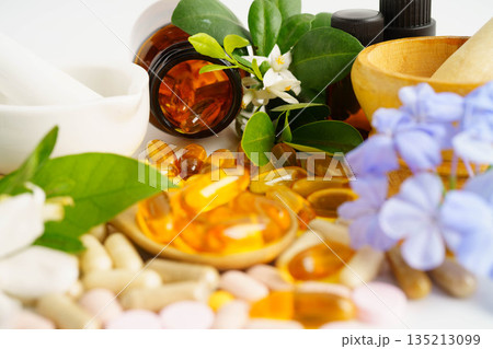 Alternative medicine herbal organic capsule with vitamin E omega 3 fish oil, mineral, drug with herbs leaf natural supplements for healthy good life. 135213099