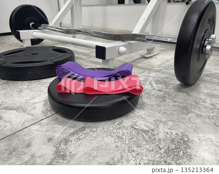 elastic resistance bands near the weight barbell elastic resistance bands near the weight barbell 135213364