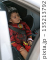 Child sleeping in car 135213792