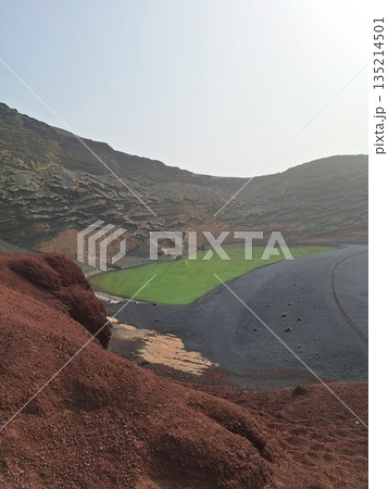 Lanzarote volcanic Lake and ocean beach in El Golfo, Canary Islands, Spain. Charco de los Clicos 135214501