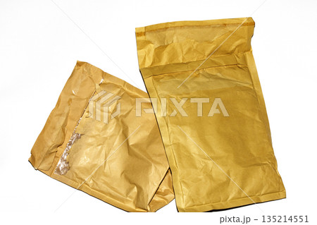Packing envelope padded mailer bag opened and empty recycling shipping postal waste Packing envelope padded mailer bag opened and empty recycling shipping postal waste 135214551