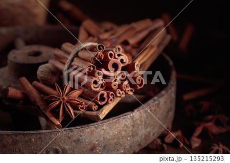 Cinnamon sticks, anise, and nutmeg on a wooden table. Cinnamon sticks, anise, and nutmeg on a wooden table. 135215293