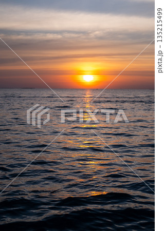 Sunset view of the sea, with colorful sky Sunset view of the sea, with colorful sky 135215499