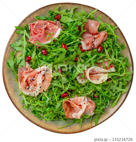 Arugula salad with prosciutto, mozzarella and pomegranate seeds isolated on white background, top view Arugula salad with prosciutto, mozzarella and pomegranate seeds isolated on white background, top view 135216726