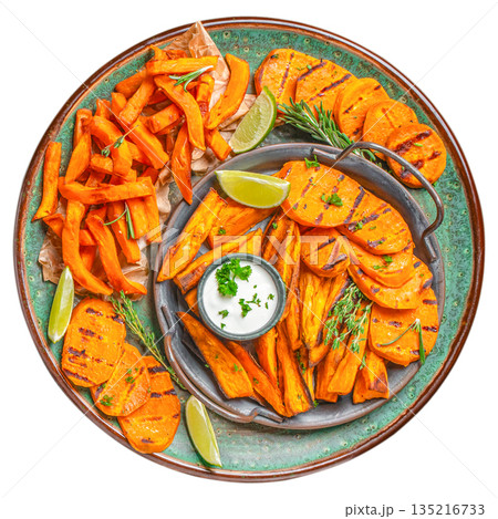 Grilled sweet potato fries and slices with herbs and dipping sauce on ceramic plate isolated on white background, top view 135216733