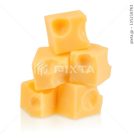 Stacked yellow cheese cubes with holes isolated on white background, dairy food concept Stacked yellow cheese cubes with holes isolated on white background, dairy food concept 135216763