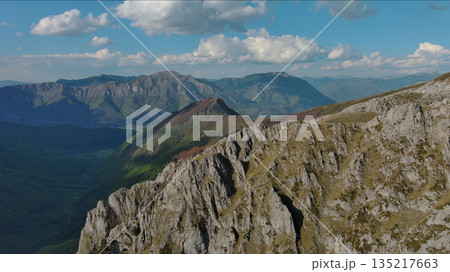 Rocky mountains and valley before sunset aerial 135217663