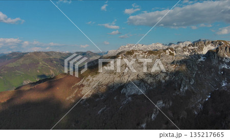 Rocky mountains and valley before sunset aerial Rocky mountains and valley before sunset aerial 135217665