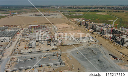 Industrial construction site with construction equipment and materials 135217710