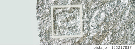 White frame on crumpled silver foil texture background abstract metallic White frame on crumpled silver foil texture background abstract metallic 135217837