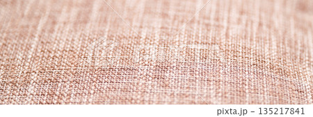 Close-up of beige textile texture with detailed weave pattern and soft natural 135217841