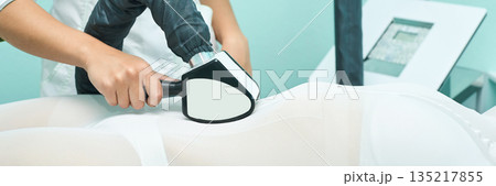 Female spa treatment with advanced laser equipment for skin health and body 135217855