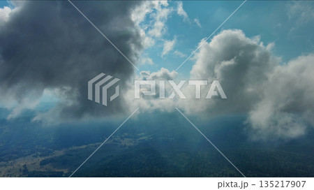 Clouds and mountains, flying in clouds 135217907