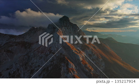 Aerial view of amazing rocky mountains at sunset Aerial view of amazing rocky mountains at sunset 135217914