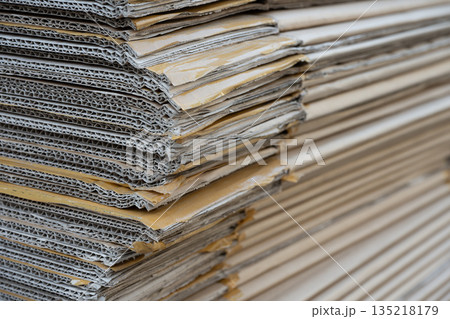Stack of Cardboard Sheets Creating Textured Industrial Background Stack of Cardboard Sheets Creating Textured Industrial Background 135218179