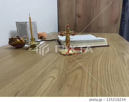 home orthodox altar with candles, crucifix and  other religion things 135218234