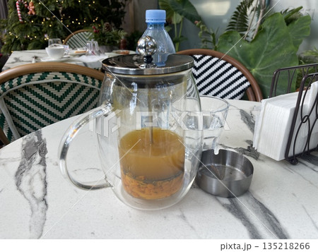teapot and cups of tea on the table 135218266