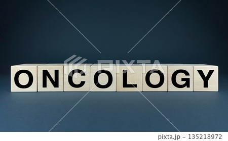 A minimalist conceptual image featuring wooden blocks spelling out the word oncology 135218972