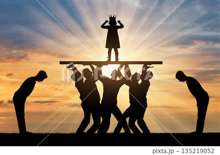 Childish selfishness. Crowd of servants is holding and worshiping a selfish child girl standing on a pedestal 135219052