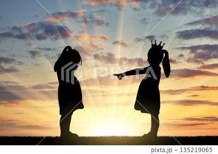 Girl points finger at another crying girl. The concept of bullying among children and at school Girl points finger at another crying girl. The concept of bullying among children and at school 135219065