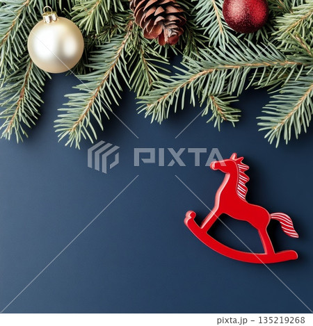 Festive Chinese New Year background with pine branches, ornaments, and a rocking horse decoration 135219268