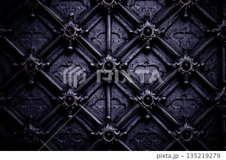 Intricate gothic architectural wall panel with dark textures and ornate detailing for visual impact Intricate gothic architectural wall panel with dark textures and ornate detailing for visual impact 135219279