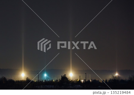Light Pillars. Rare meteorological phenomena. Winter nature landscape 135219484