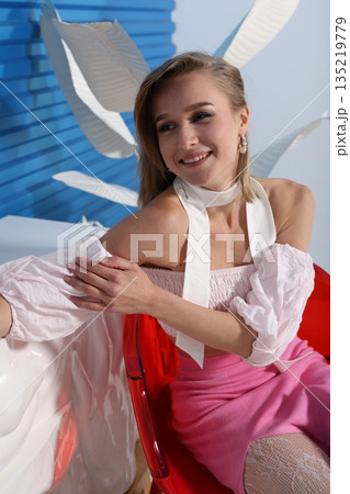 Friendly woman discusses her quirky bunny ear accessory in interview 135219779