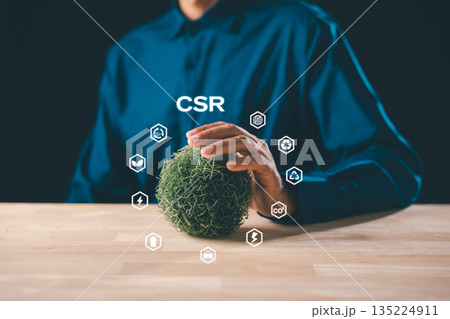 CSR, corporate social responsibility business concept, businessman hand gently cradling green earth sphere, sustainable development icons highlight global environmental energy recycle efforts CSR, corporate social responsibility business concept, businessman hand gently cradling green earth sphere, sustainable development icons highlight global environmental energy recycle efforts 135224911