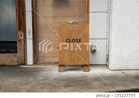 sorry we are closed sign hanging outside a restaurant, store, office or other sorry we are closed sign hanging outside a restaurant, store, office or other 135227755