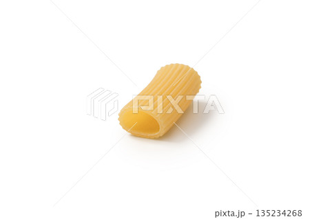 Italian dry rigatoni pasta over white background with shadow Italian dry rigatoni pasta over white background with shadow 135234268