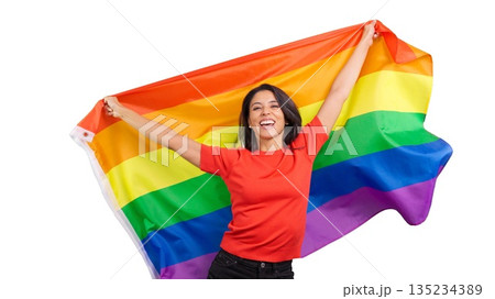 Happy woman celebrating LGBTQ plus community with rainbow flag 135234389