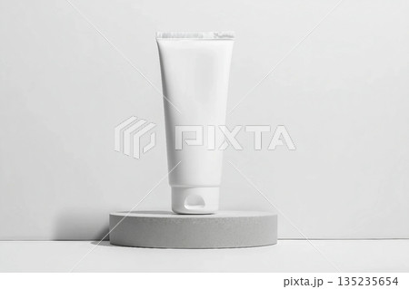 White tube mockup on pedestal on white isolated background. Concept of beauty products, face and body skin care. Image for your design 135235654