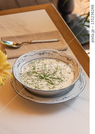 Cold okroshka soup with herbs served in bowl Cold okroshka soup with herbs served in bowl 135236266