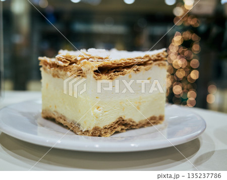 Elegant pastry featuring vanilla filling and holidaythemed presentation 135237786