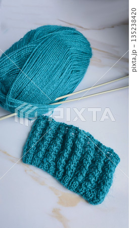 Knitting patterns and details for sweaters, hats, and other crocheted items. 135238420