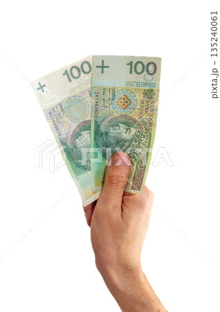Old and new one version of 100 PLN banknote in hand. 135240061