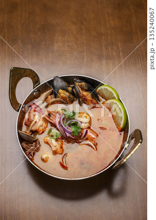 mixed seafood tom yum thai curry soup indoors ina a phuket thailand restaurant mixed seafood tom yum thai curry soup indoors ina a phuket thailand restaurant 135240067
