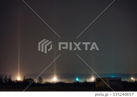 Light Pillars. Rare meteorological phenomena. Winter nature landscape 135240657