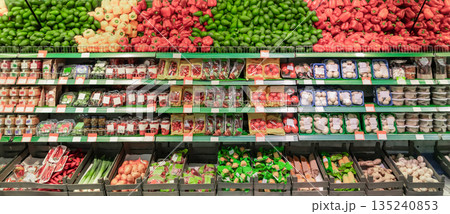 Grocery store. Fresh vegetables and fruits in a colorful showcase. Beautiful fruit and vegetable merchandising. High quality photo Grocery store. Fresh vegetables and fruits in a colorful showcase. Beautiful fruit and vegetable merchandising. High quality photo 135240853