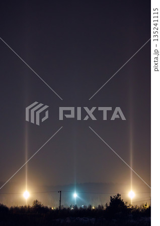 Light Pillars. Rare meteorological phenomena. Winter nature landscape Light Pillars. Rare meteorological phenomena. Winter nature landscape 135241115