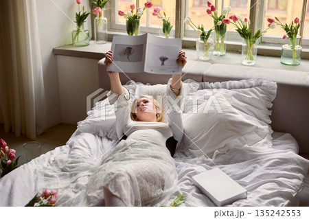 Serene morning amidst blooming tulips, Tranquil home setting filled with tulips and soft natural lighting Serene morning amidst blooming tulips, Tranquil home setting filled with tulips and soft natural lighting 135242553