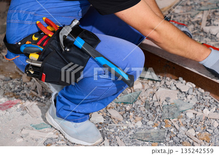 Closeup of toolkit on work uniform with accessories and dust 135242559