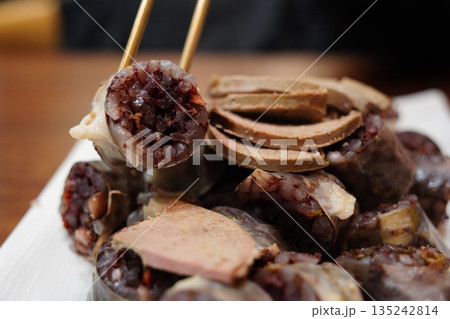 Delicious Korean blood sausage (Sundae) with liver slices, a popular traditional street food Delicious Korean blood sausage (Sundae) with liver slices, a popular traditional street food 135242814