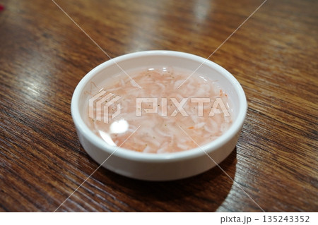 Delicious Korean salted fermented shrimp (Saeujeot) in a white bowl, a traditional condiment Delicious Korean salted fermented shrimp (Saeujeot) in a white bowl, a traditional condiment 135243352