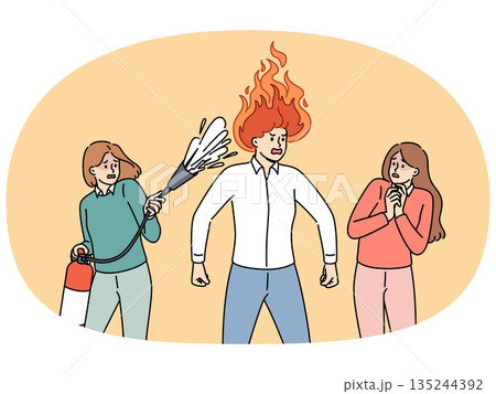 Aggressive man with flame on head stands near frightened colleagues with fire extinguisher Aggressive man with flame on head stands near frightened colleagues with fire extinguisher 135244392