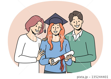 Girl graduate in student hat holds certificate of higher education, standing with parents Girl graduate in student hat holds certificate of higher education, standing with parents 135244401